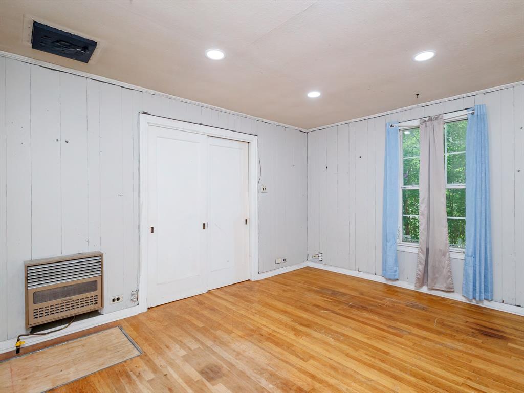 510 South Main Street Rising Star, TX 76471 - Photo 40 of 40 a view of an empty room with wooden floor and a window