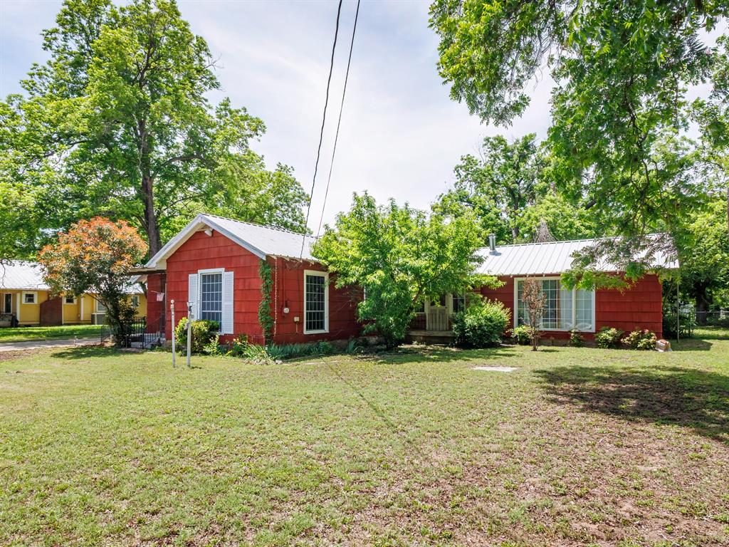 510 South Main Street Rising Star, TX 76471 - Photo 4 of 40 a front view of a house with a yard and garage