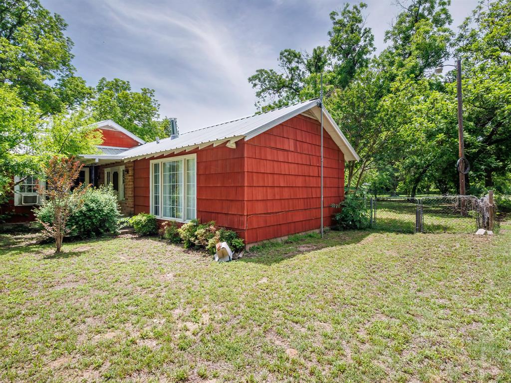 510 South Main Street Rising Star, TX 76471 - Photo 6 of 40 a view of an house with backyard space and garden