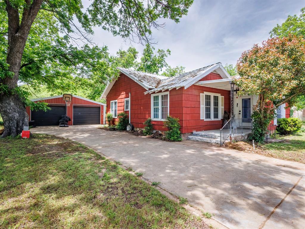 510 South Main Street Rising Star, TX 76471 - Photo 8 of 40 a front view of house with yard and trees around