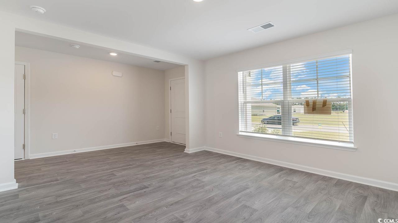 507 Harvest Rdg Way Conway, SC 29527 - Photo 9 of 32 Empty room featuring wood-type flooring