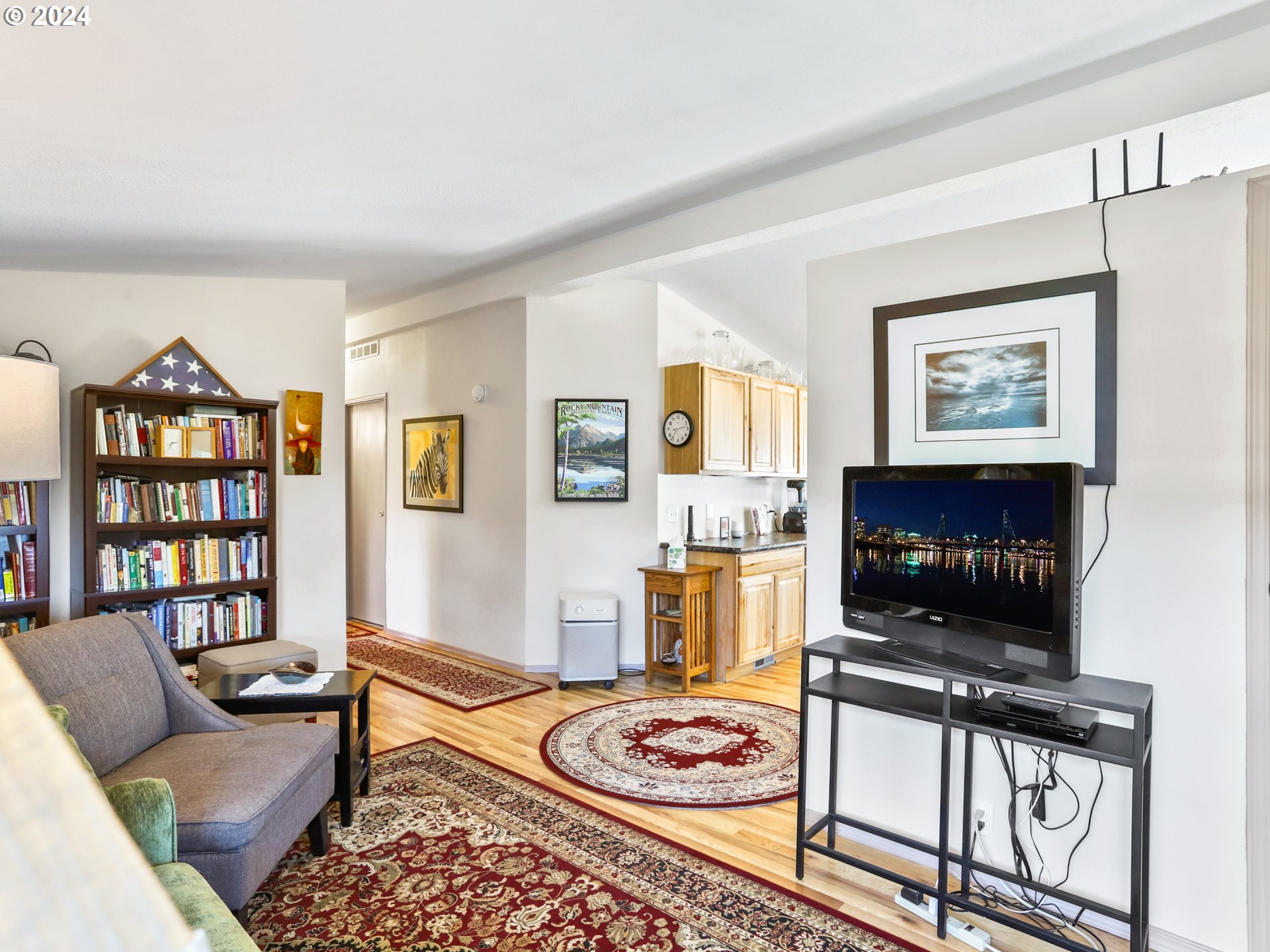 900 Northeast Francis Avenue Gresham, OR 97030 - Photo 14 of 16 a living room with furniture a flat screen tv and a table