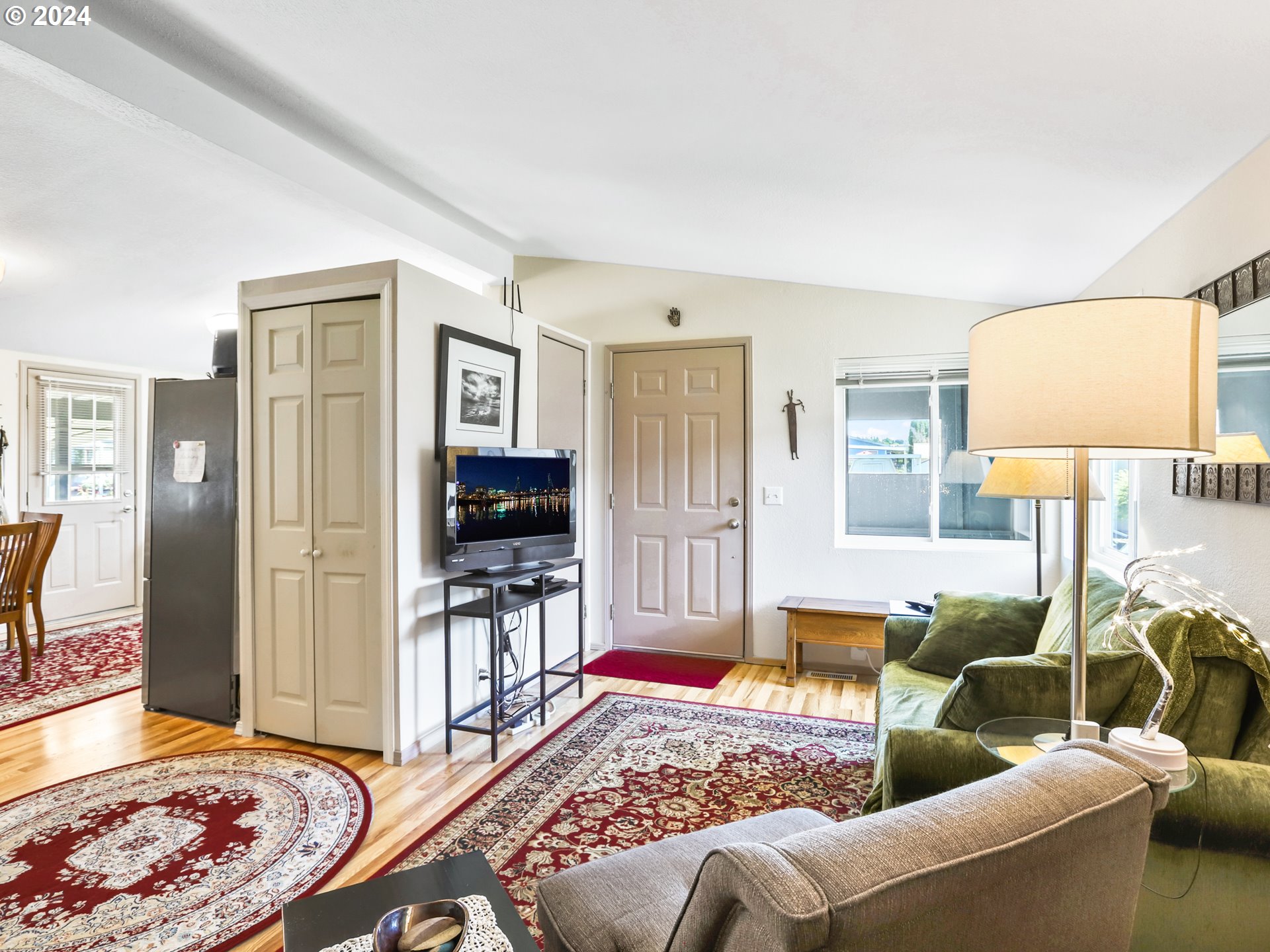 900 Northeast Francis Avenue Gresham, OR 97030 - Photo 15 of 16 a living room with furniture and a flat screen tv