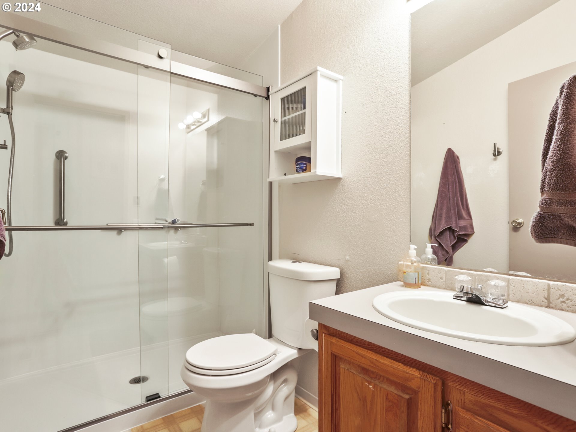 900 Northeast Francis Avenue Gresham, OR 97030 - Photo 16 of 16 a bathroom with a sink toilet and shower