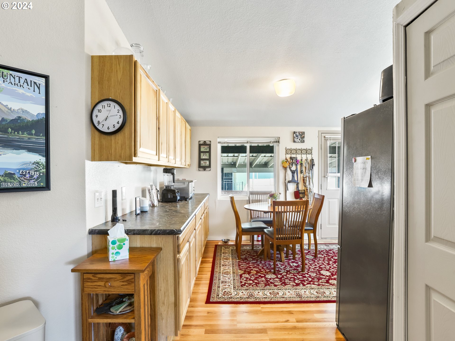 900 Northeast Francis Avenue Gresham, OR 97030 - Photo 7 of 16 a view of a dining room with furniture window and wooden floor