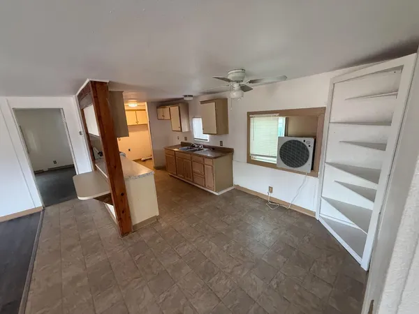a view of a livingroom with furniture and windows