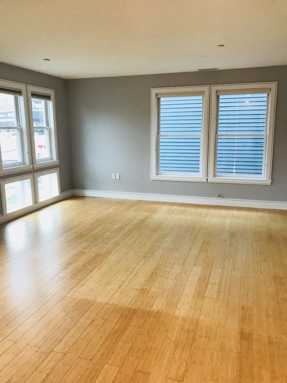 2 Boylston Street, Unit 3 Boston, MA 02130 - Photo 2 of 9 a view of an empty room with a window