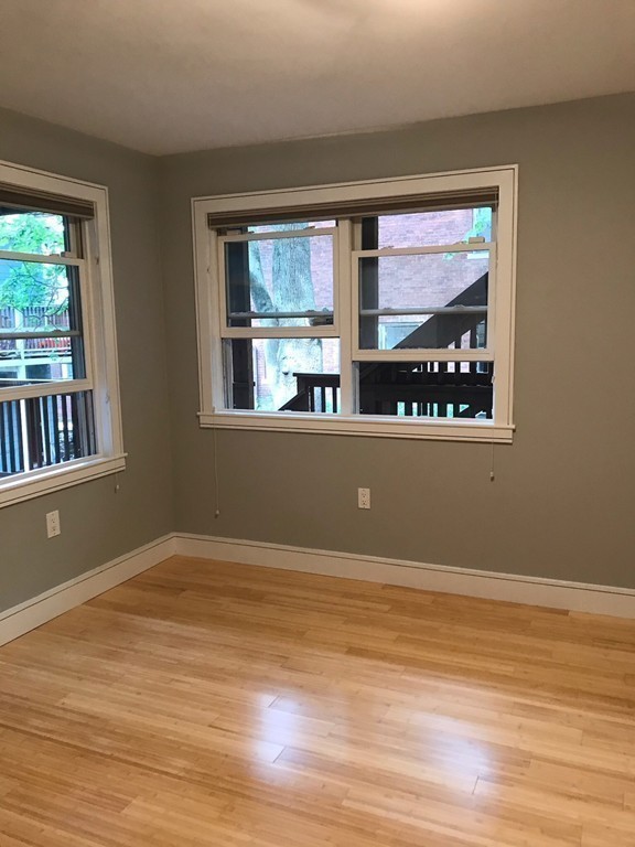 2 Boylston Street, Unit 3 Boston, MA 02130 - Photo 8 of 9 a view of a room with wooden floor and cabinet
