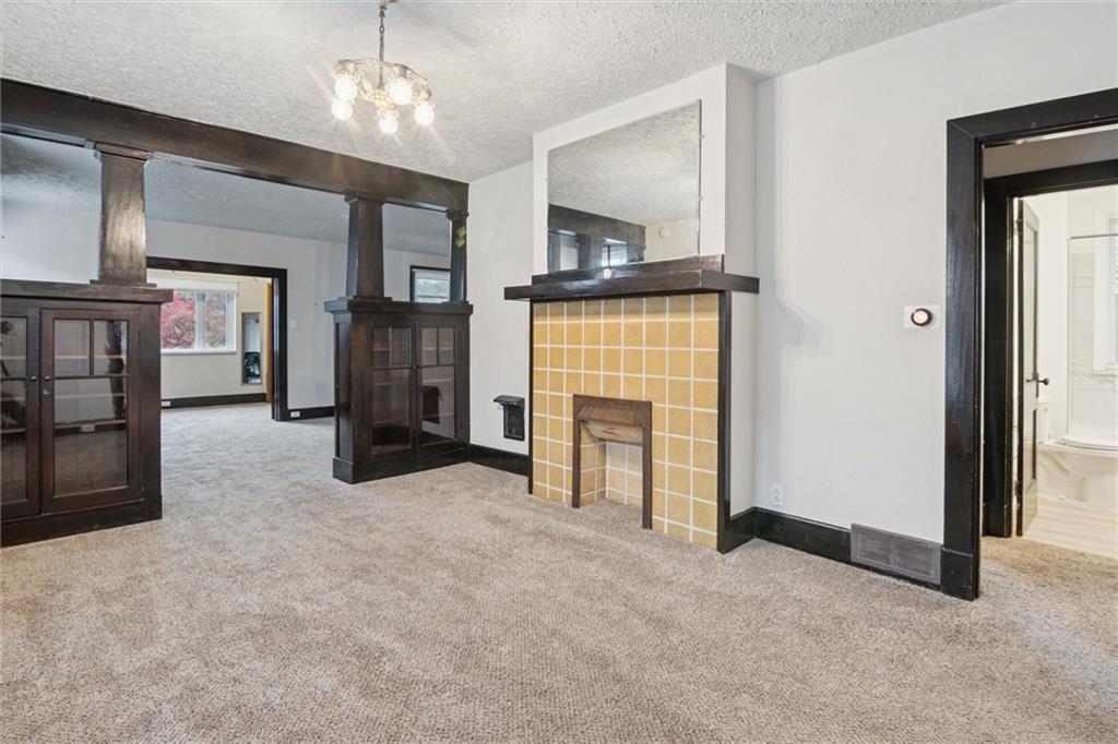 3518 Beechwood Boulevard Pittsburgh, PA 15217 - Photo 11 of 34 an empty room with furniture and a fireplace