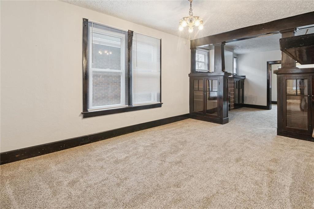 3518 Beechwood Boulevard Pittsburgh, PA 15217 - Photo 12 of 34 an empty room with fireplace and windows
