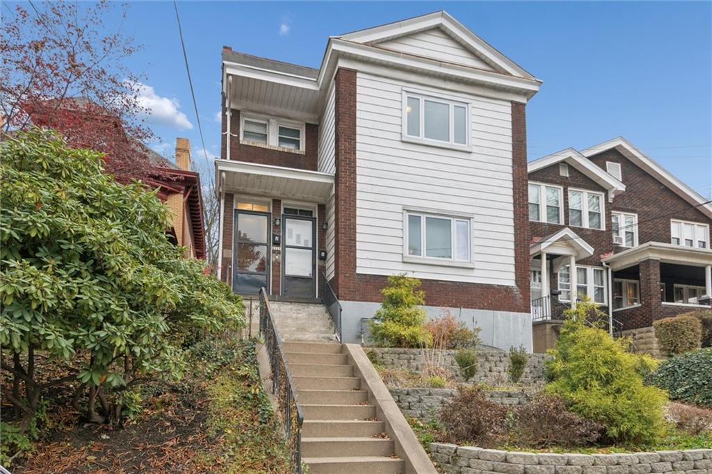 3518 Beechwood Boulevard Pittsburgh, PA 15217 - Photo 2 of 34 a front view of a house with a yard