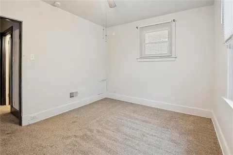 a view of a garage with wooden floors