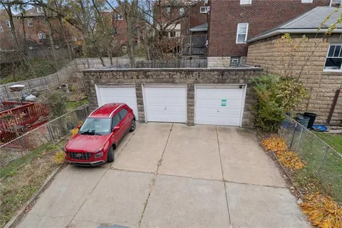a view of a car park in front of house
