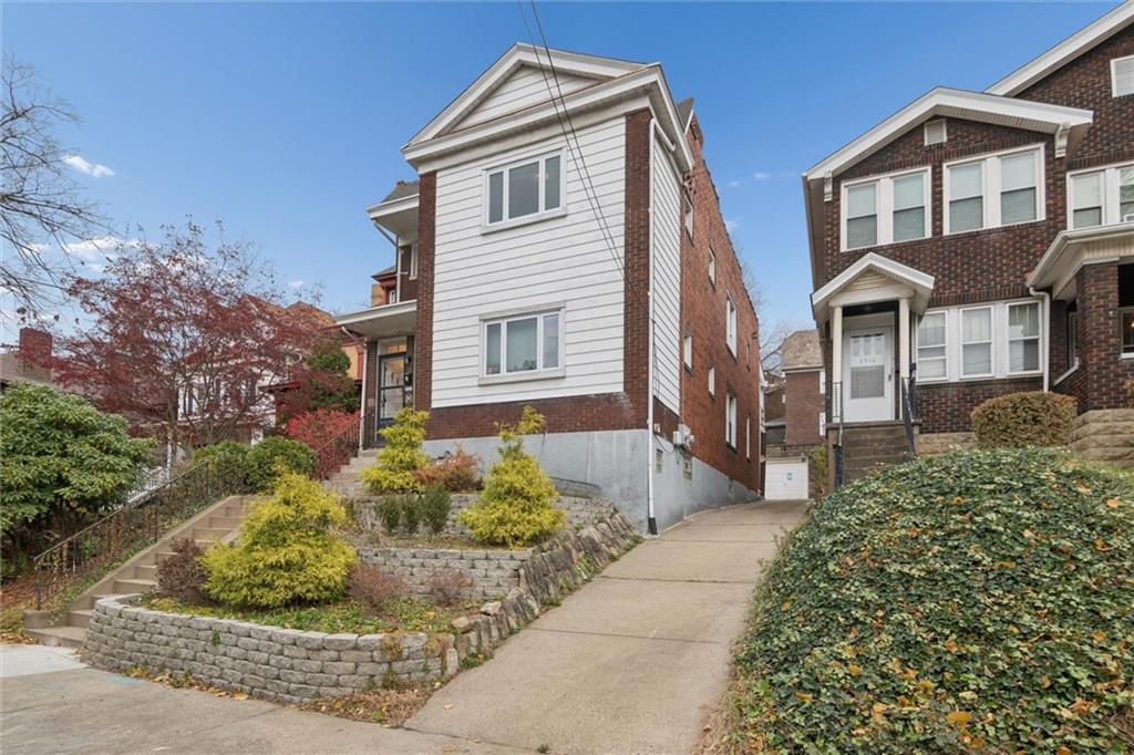 3518 Beechwood Boulevard Pittsburgh, PA 15217 - Photo 3 of 34 a front view of a house with garden