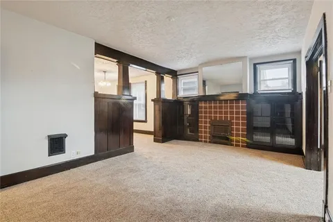 a view of a big room with windows and closet