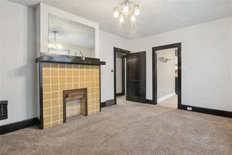 an empty room with fireplace