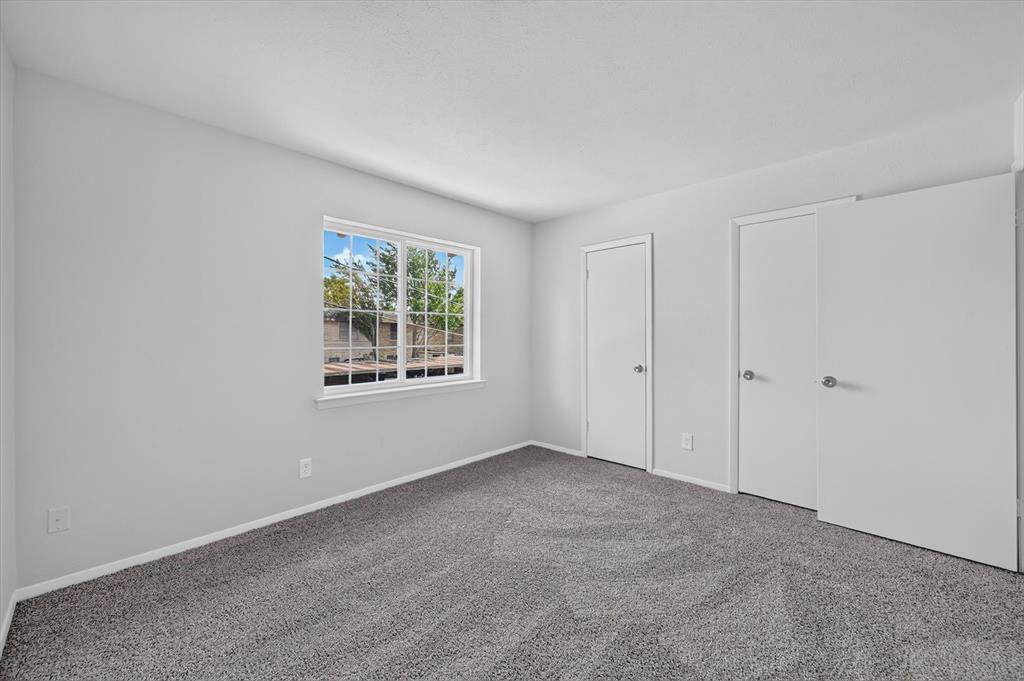 1801 East Grauwyler Road, Unit 101 Irving, TX 75061 - Photo 20 of 39 a view of an empty room with a window