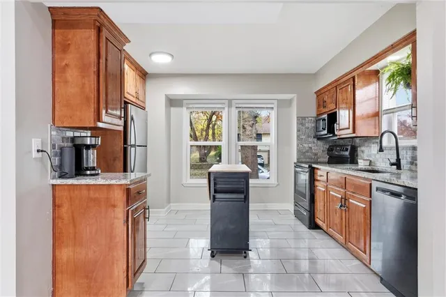 $305,000 | 302 Southeast Flagstone Street, Lee's Summit, MO 64063