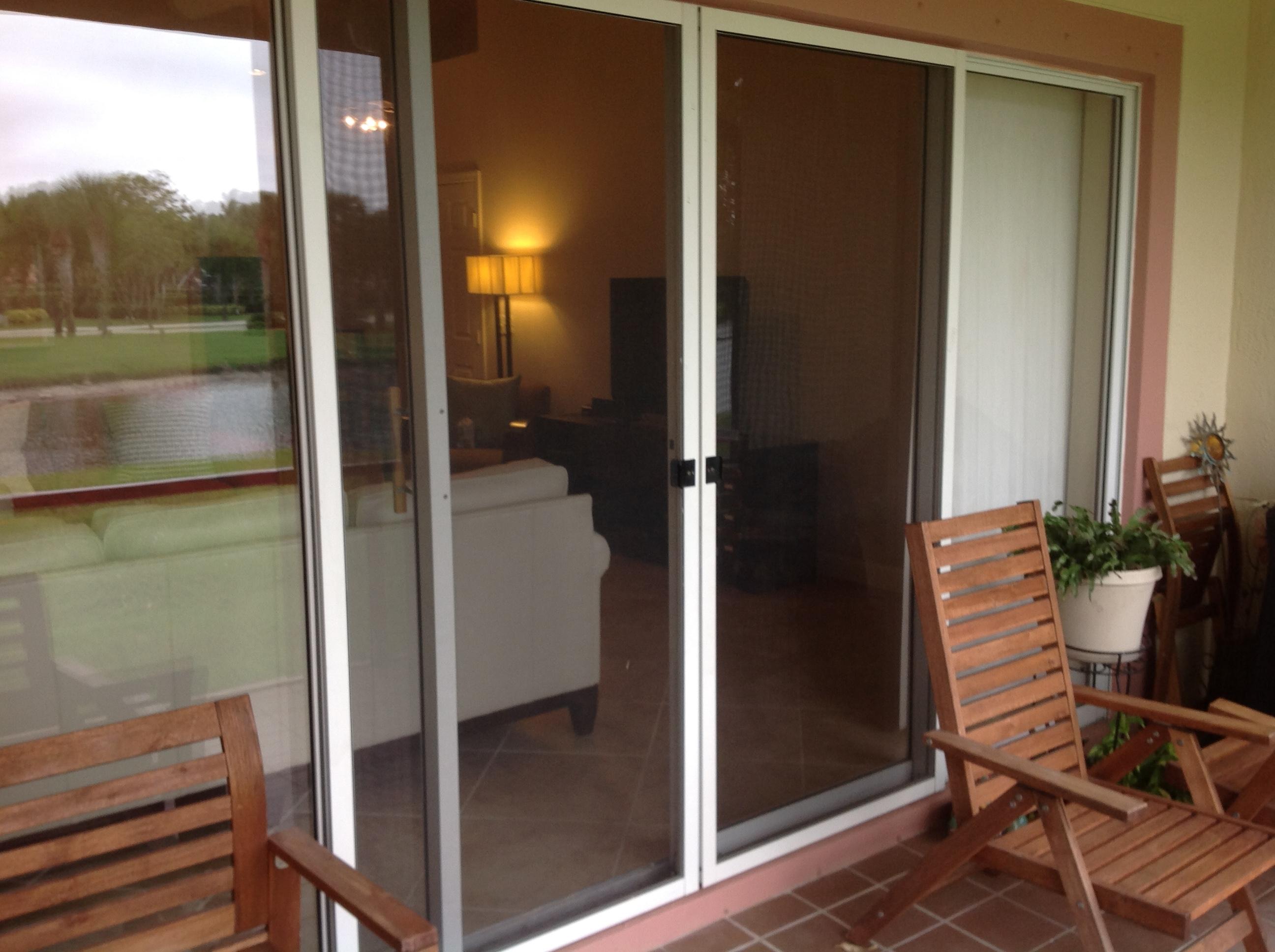 8388 Via Leonessa Boca Raton, FL 33433 - Photo 18 of 38 Slidders lead to back screened patio