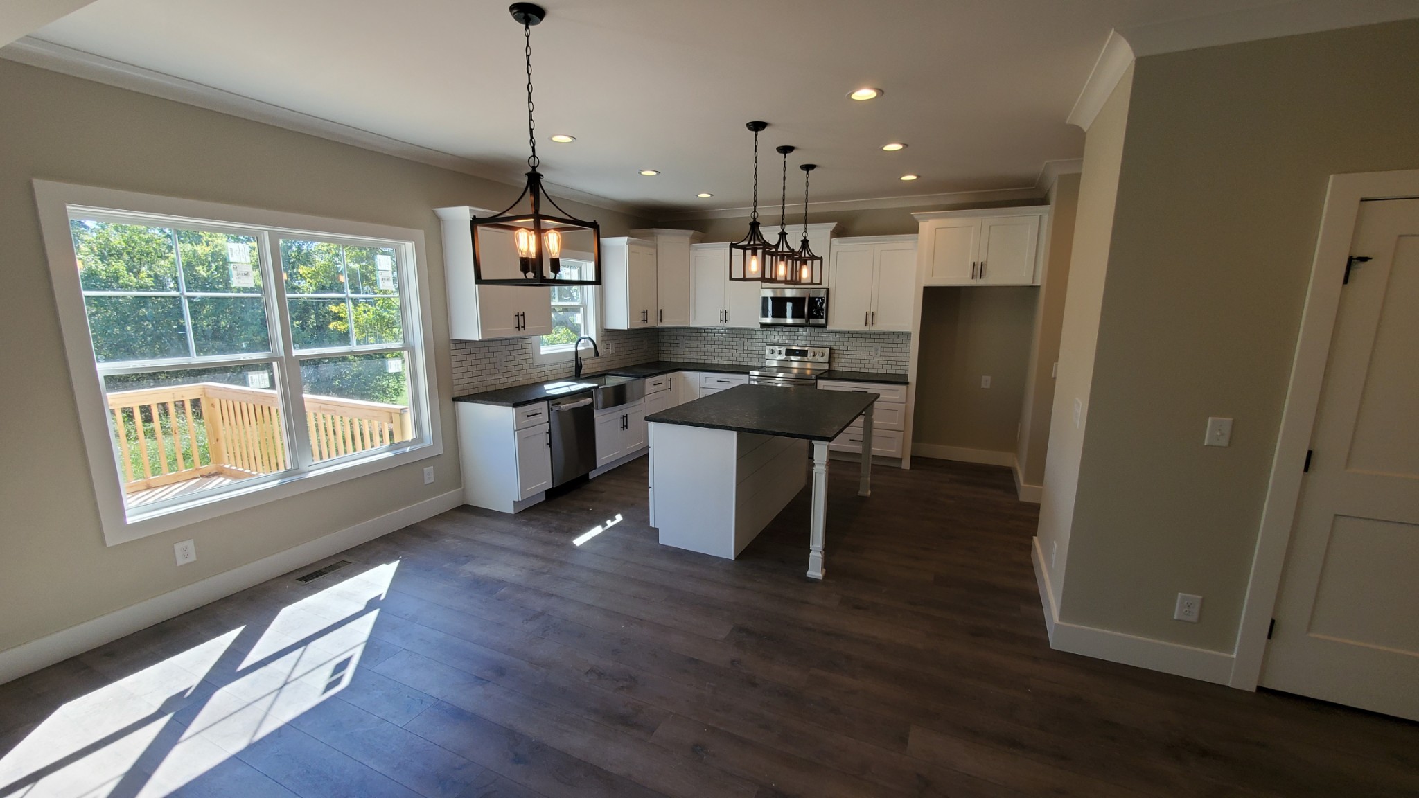 4000 Beasleys Bend Road Lebanon, TN 37087 - Photo 11 of 26 a kitchen with stainless steel appliances granite countertop sink stove and wooden floor
