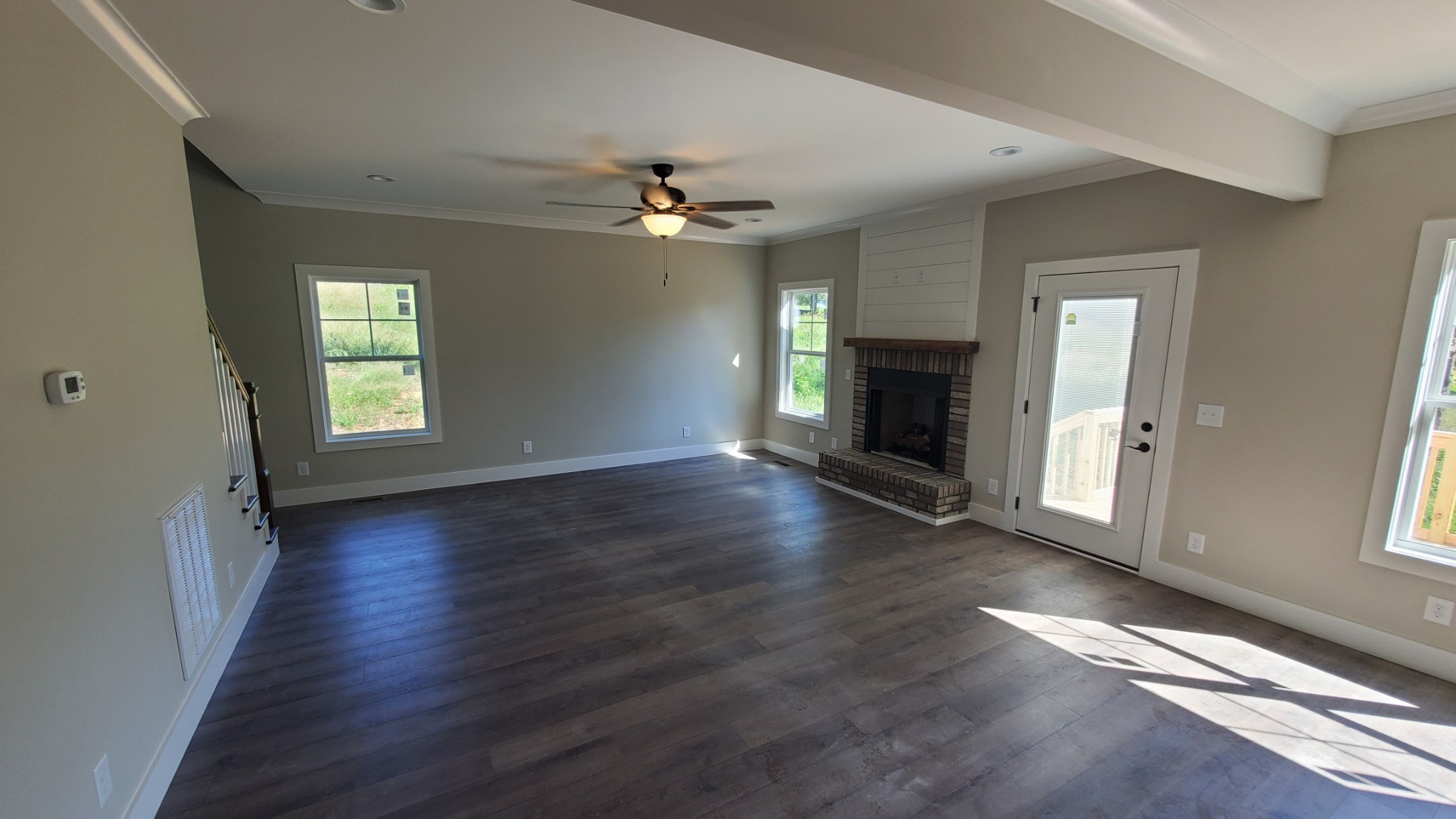 4000 Beasleys Bend Road Lebanon, TN 37087 - Photo 12 of 26 an empty room with wooden floor fireplace and windows