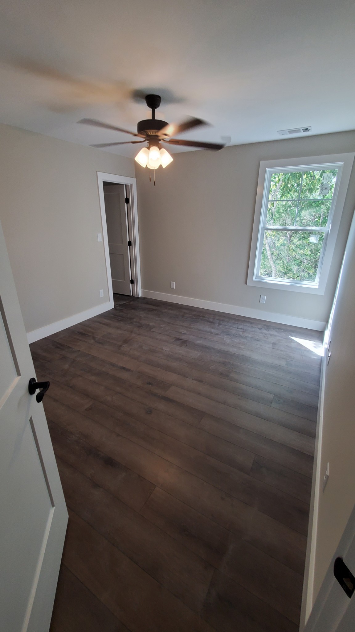 4000 Beasleys Bend Road Lebanon, TN 37087 - Photo 18 of 26 wooden floor in an empty room with a window