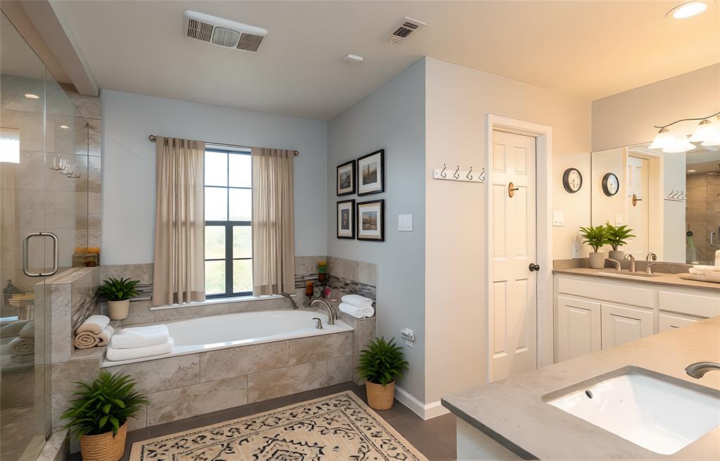 13 Crestview Circle Rockwall, TX 75087 - Photo 23 of 37 a spacious bathroom with a tub a mirror and a shower