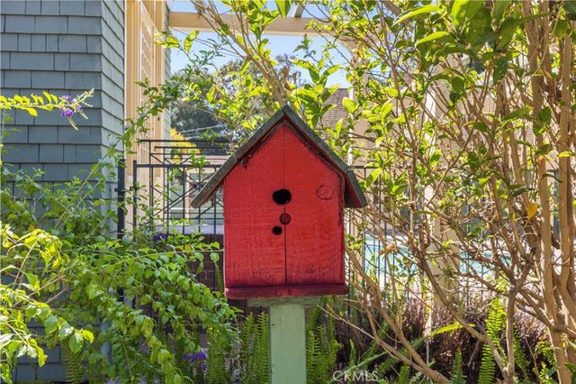 a view of empty room with wooden floor and fireplace