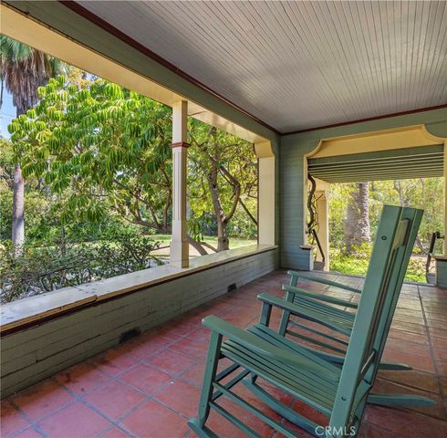 a view of a livingroom with furniture window and wooden floor