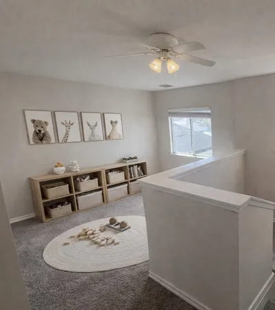 a view of a dining room with furniture and window