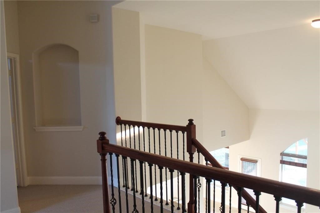 2513 Rusk Court Round Rock, TX 78665 - Photo 24 of 39 Hall with light colored carpet and baseboards