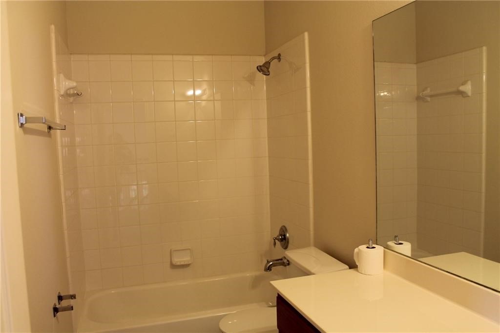 2513 Rusk Court Round Rock, TX 78665 - Photo 28 of 39 Full bathroom with vanity and bathing tub / shower combination