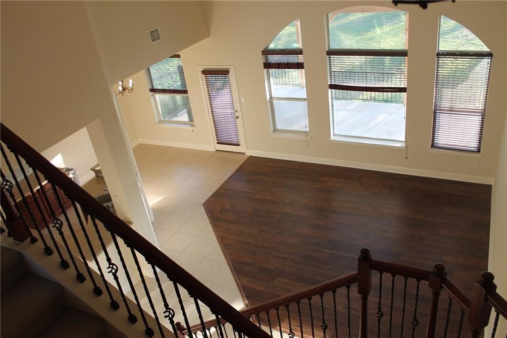 2513 Rusk Court Round Rock, TX 78665 - Photo 3 of 39 Stairway with a chandelier and tile patterned flooring