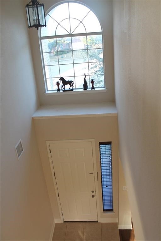2513 Rusk Court Round Rock, TX 78665 - Photo 35 of 39 Entrance foyer with tile patterned floors and baseboards