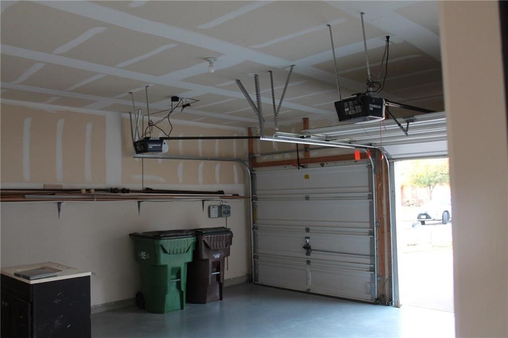 2513 Rusk Court Round Rock, TX 78665 - Photo 36 of 39 Garage with a garage door opener
