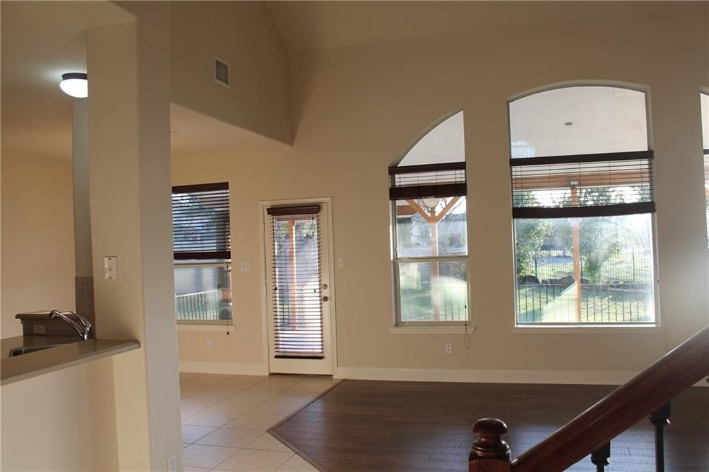2513 Rusk Court Round Rock, TX 78665 - Photo 6 of 39 Foyer with light wood-style flooring and baseboards