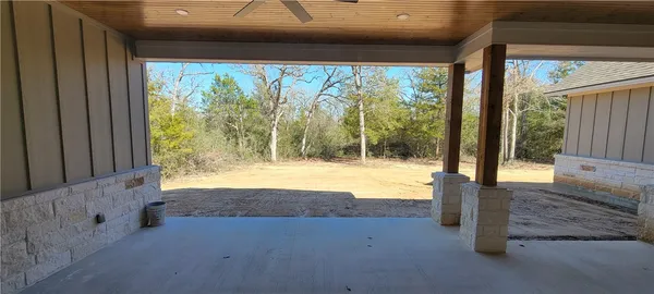 a view of backyard and porch