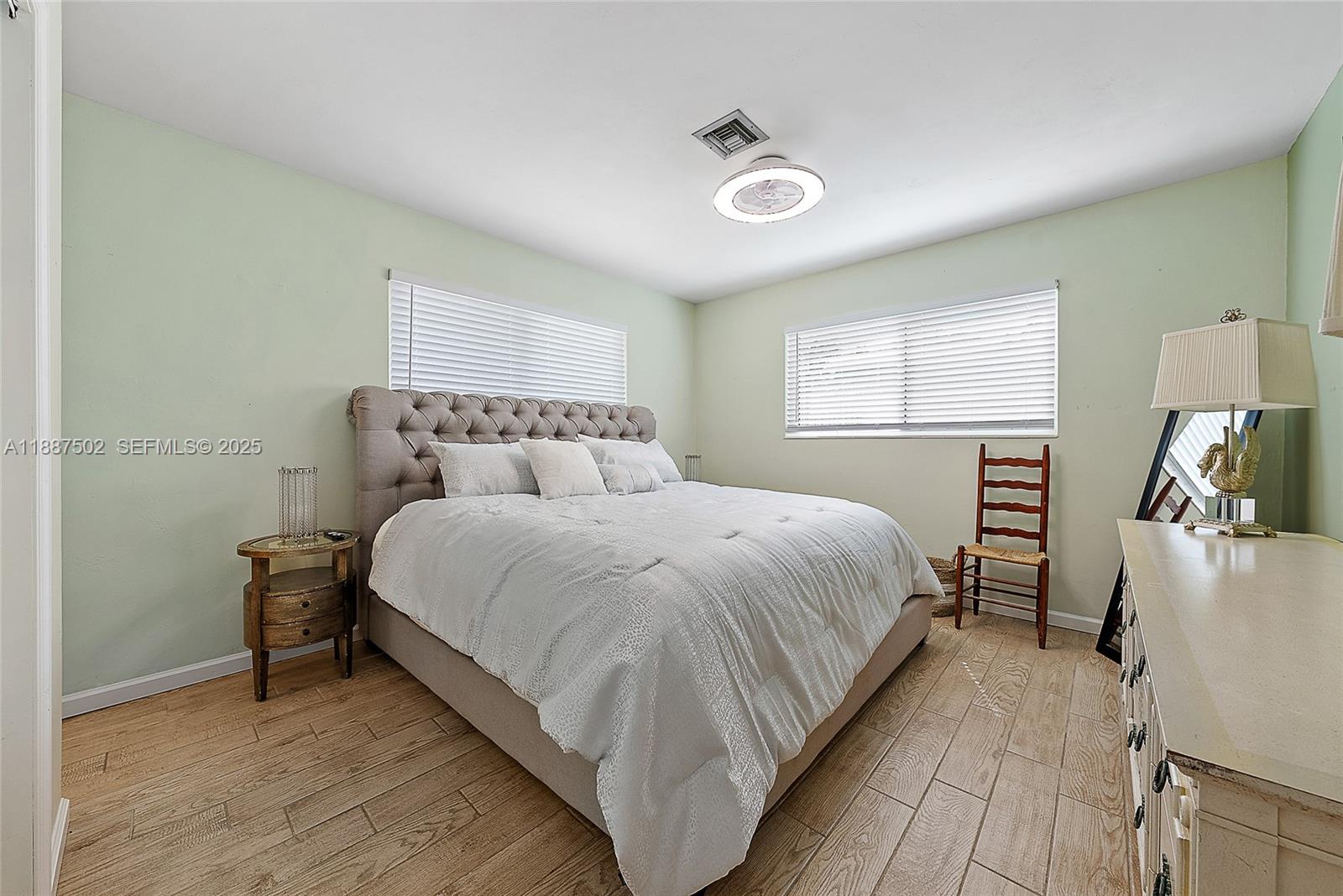 367 West Riverside Drive Tequesta, FL 33469 - Photo 11 of 23 a bedroom with a bed and a tv