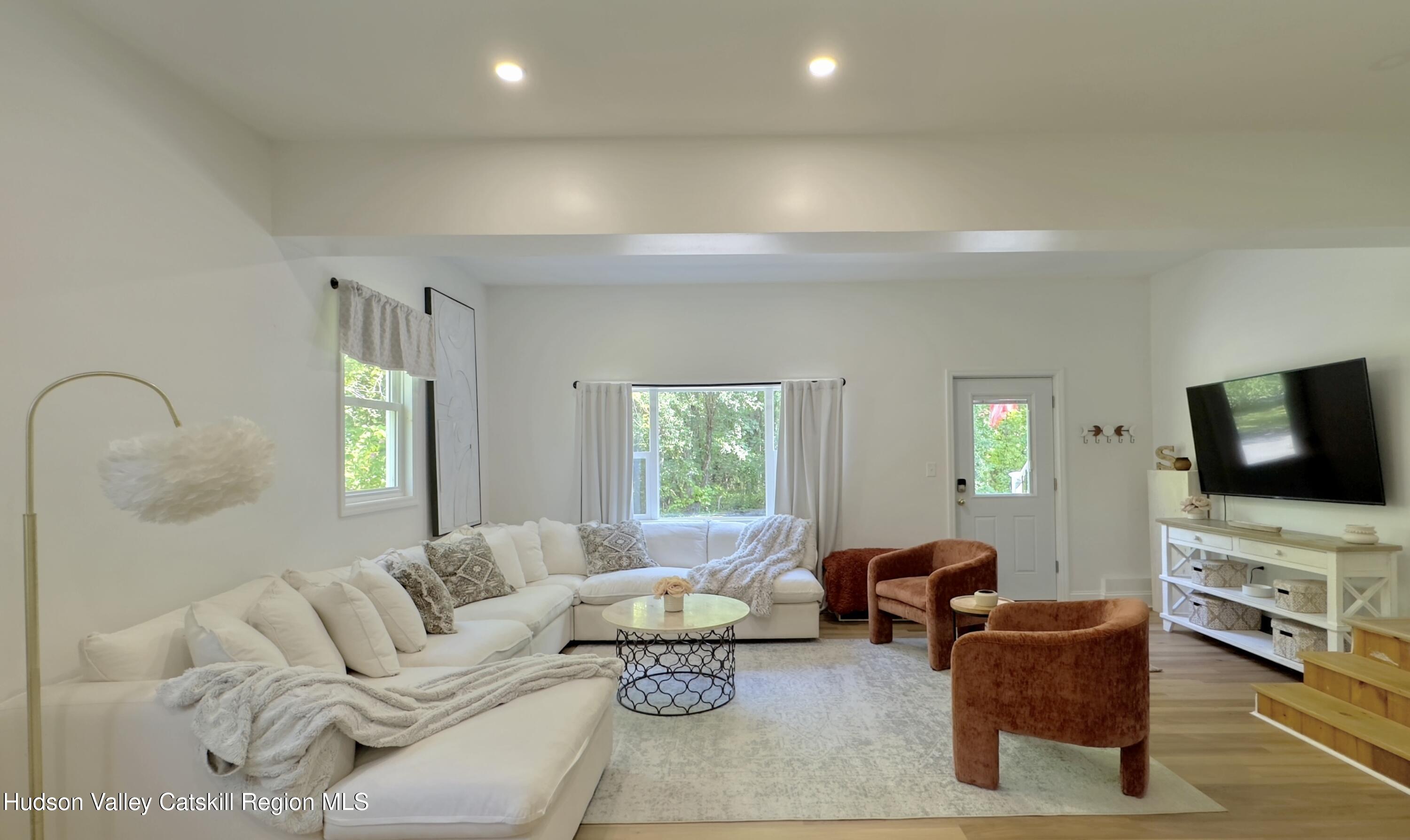 1801 Sleepy Hollow Road Athens, NY 12015 - Photo 12 of 34 a living room with furniture and a flat screen tv