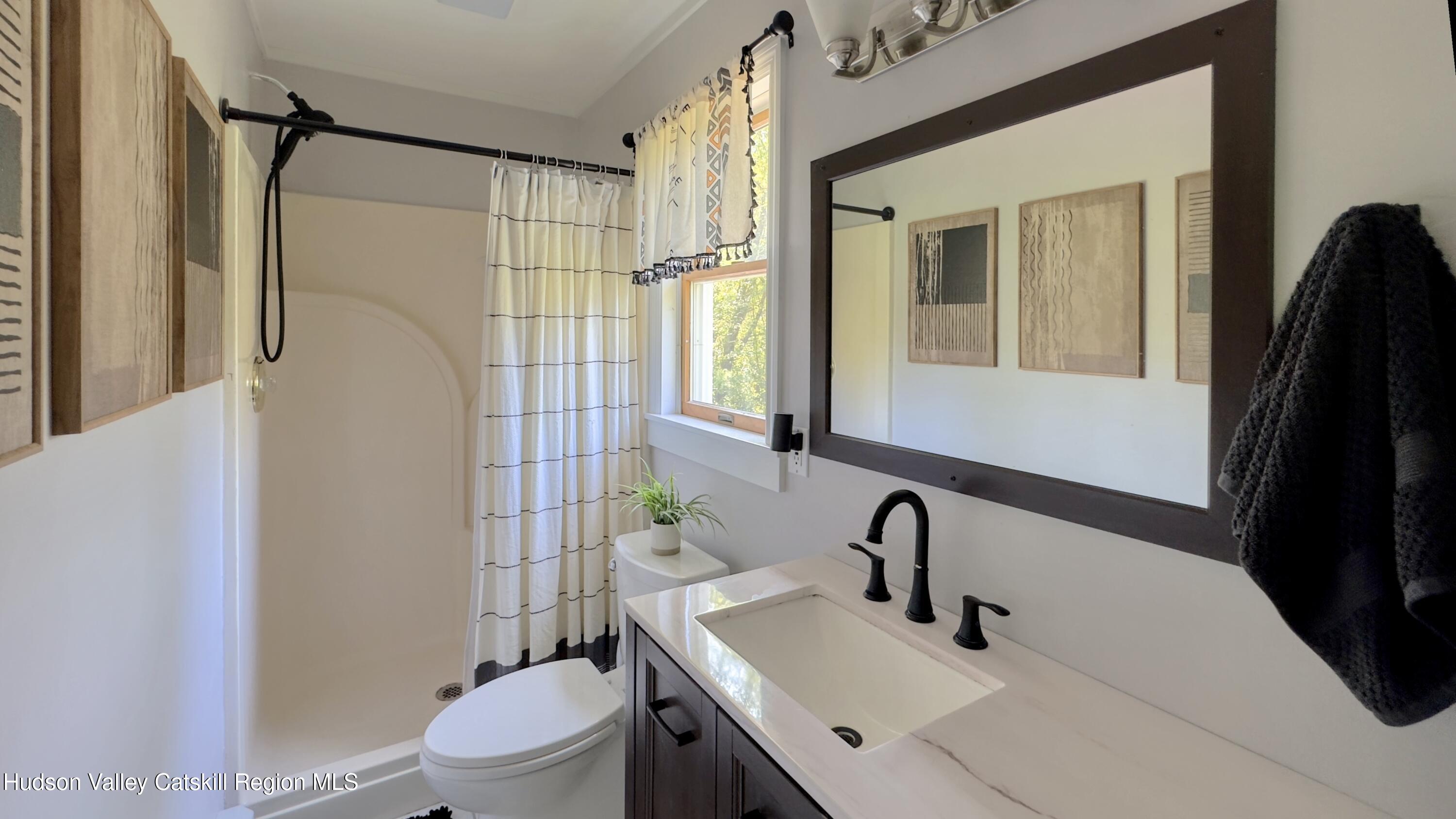 1801 Sleepy Hollow Road Athens, NY 12015 - Photo 21 of 34 a bathroom with a sink toilet and shower