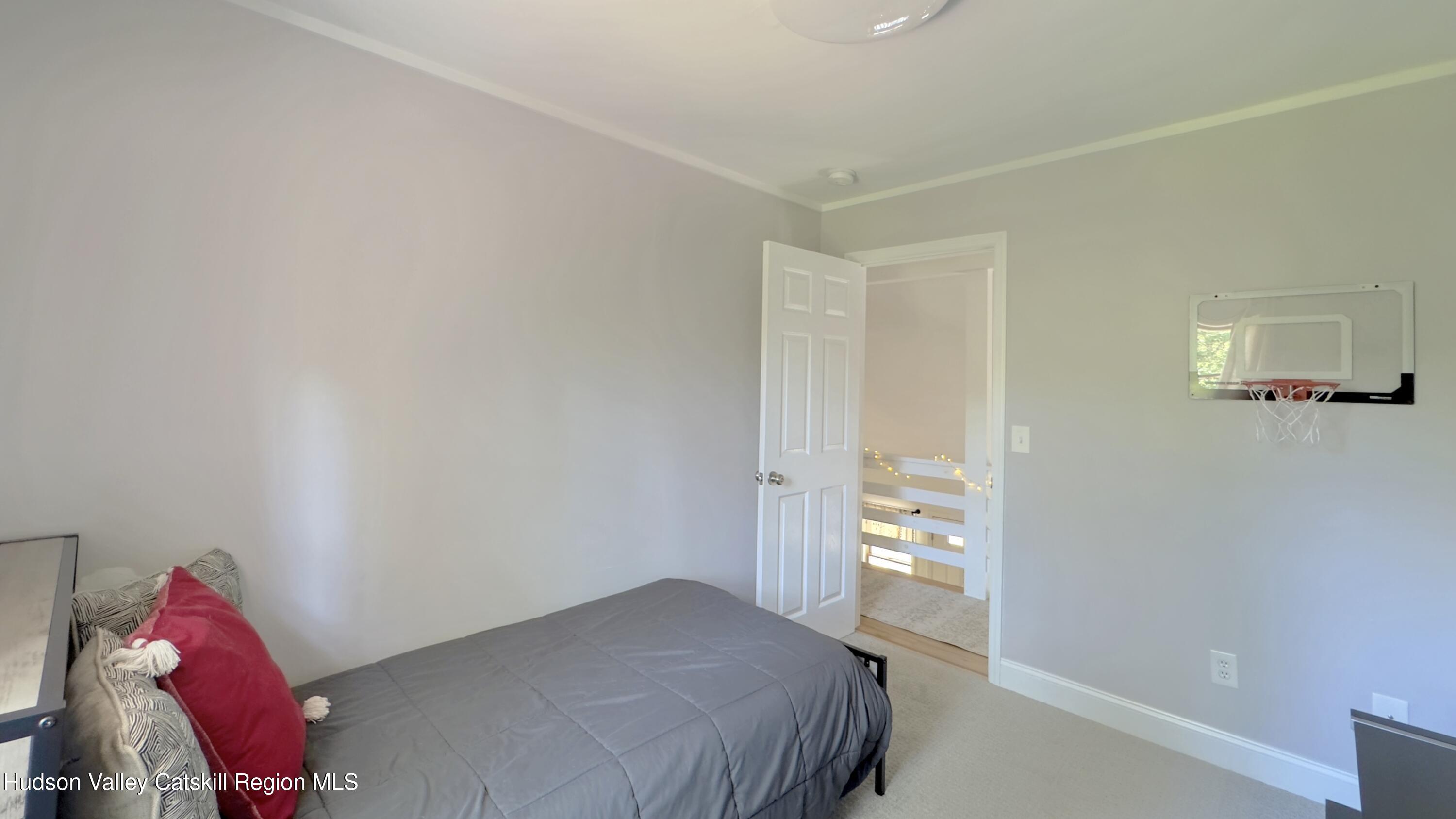 1801 Sleepy Hollow Road Athens, NY 12015 - Photo 22 of 34 a bedroom with a bed and a window