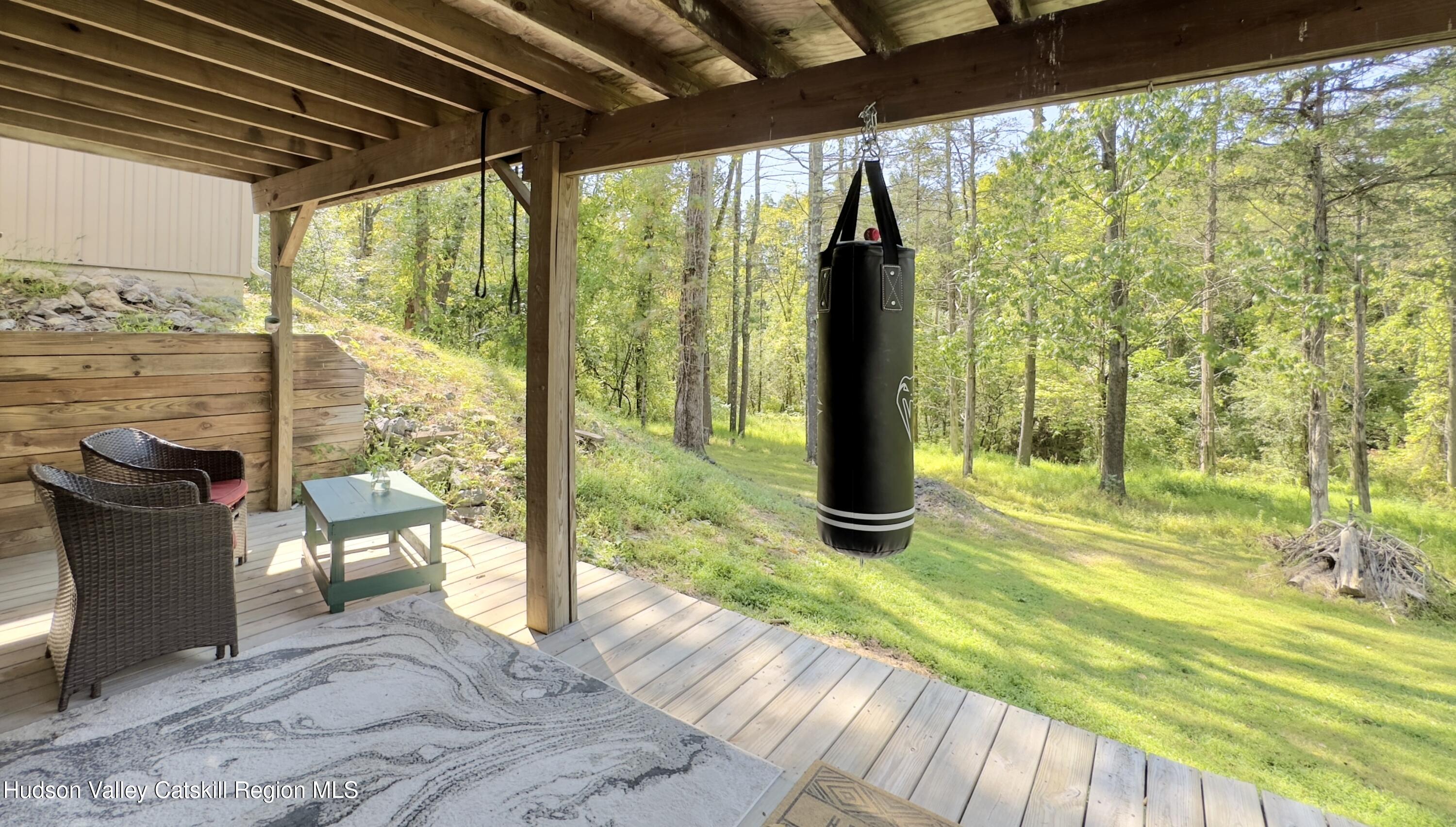1801 Sleepy Hollow Road Athens, NY 12015 - Photo 30 of 34 a view of a patio with a table chairs and wooden floor
