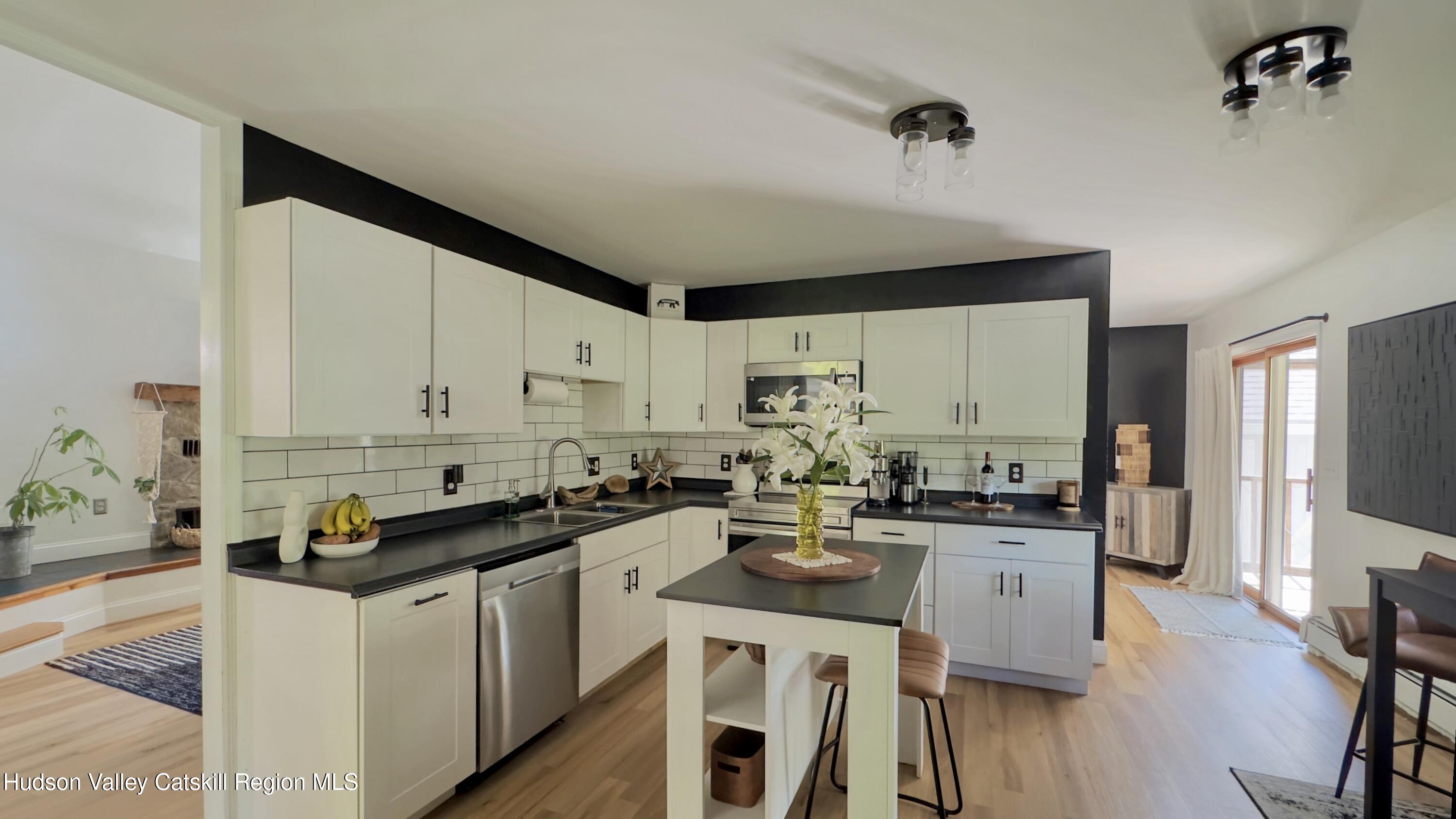 1801 Sleepy Hollow Road Athens, NY 12015 - Photo 3 of 34 a kitchen with a sink stove and cabinets
