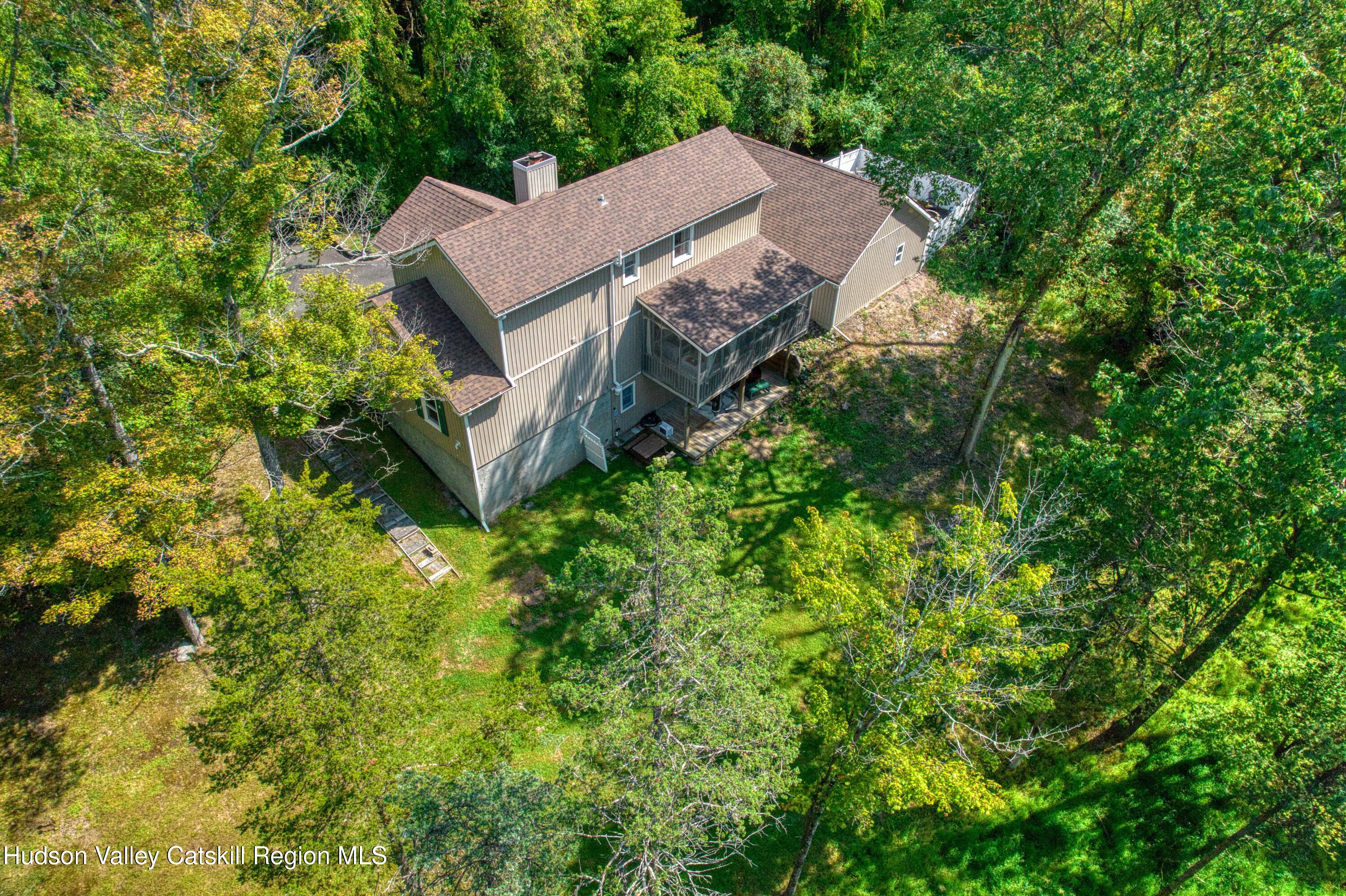 1801 Sleepy Hollow Road Athens, NY 12015 - Photo 34 of 34 a aerial view of a house with yard and outdoor seating