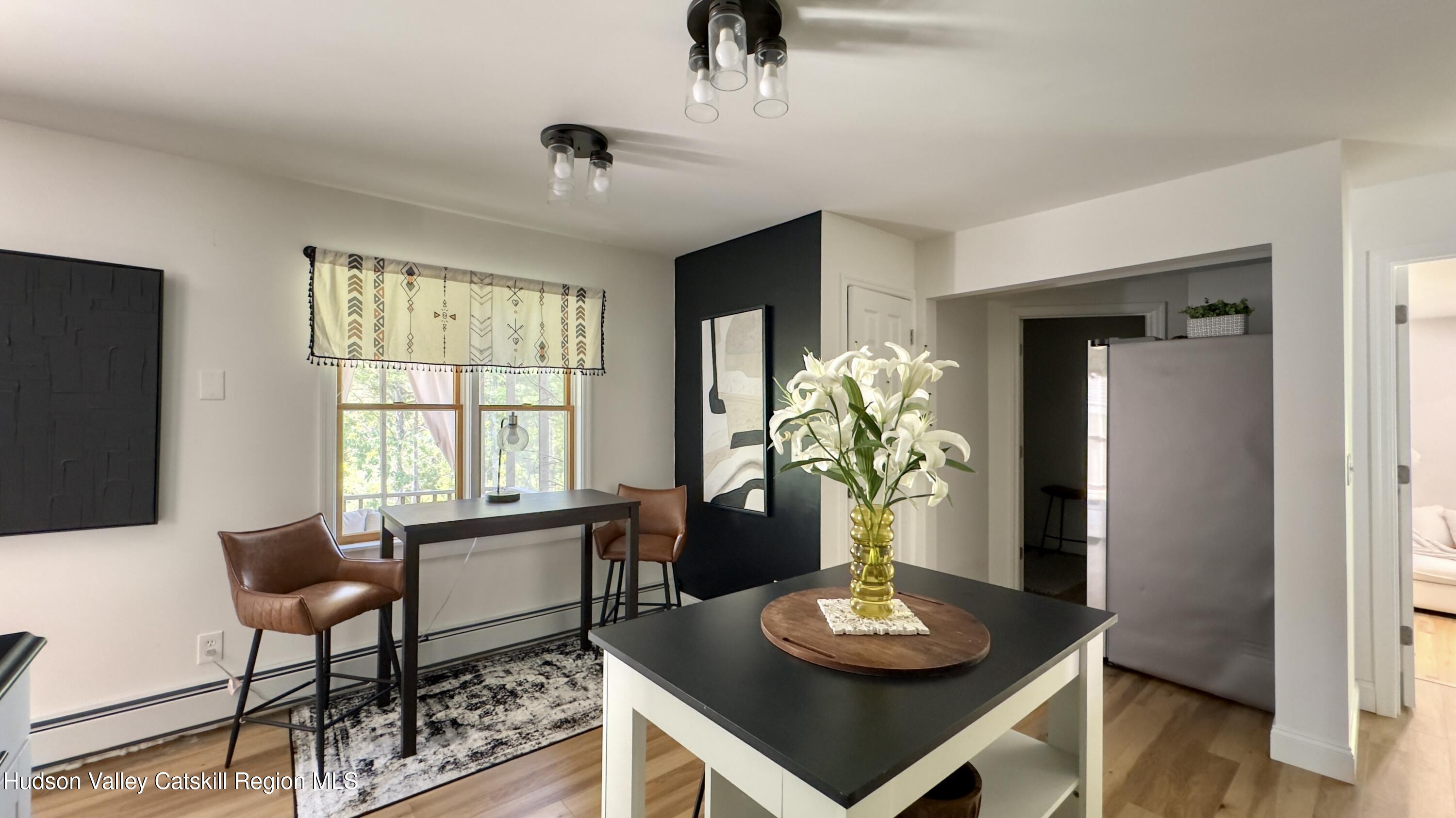 1801 Sleepy Hollow Road Athens, NY 12015 - Photo 6 of 34 a living room with furniture and a potted plant