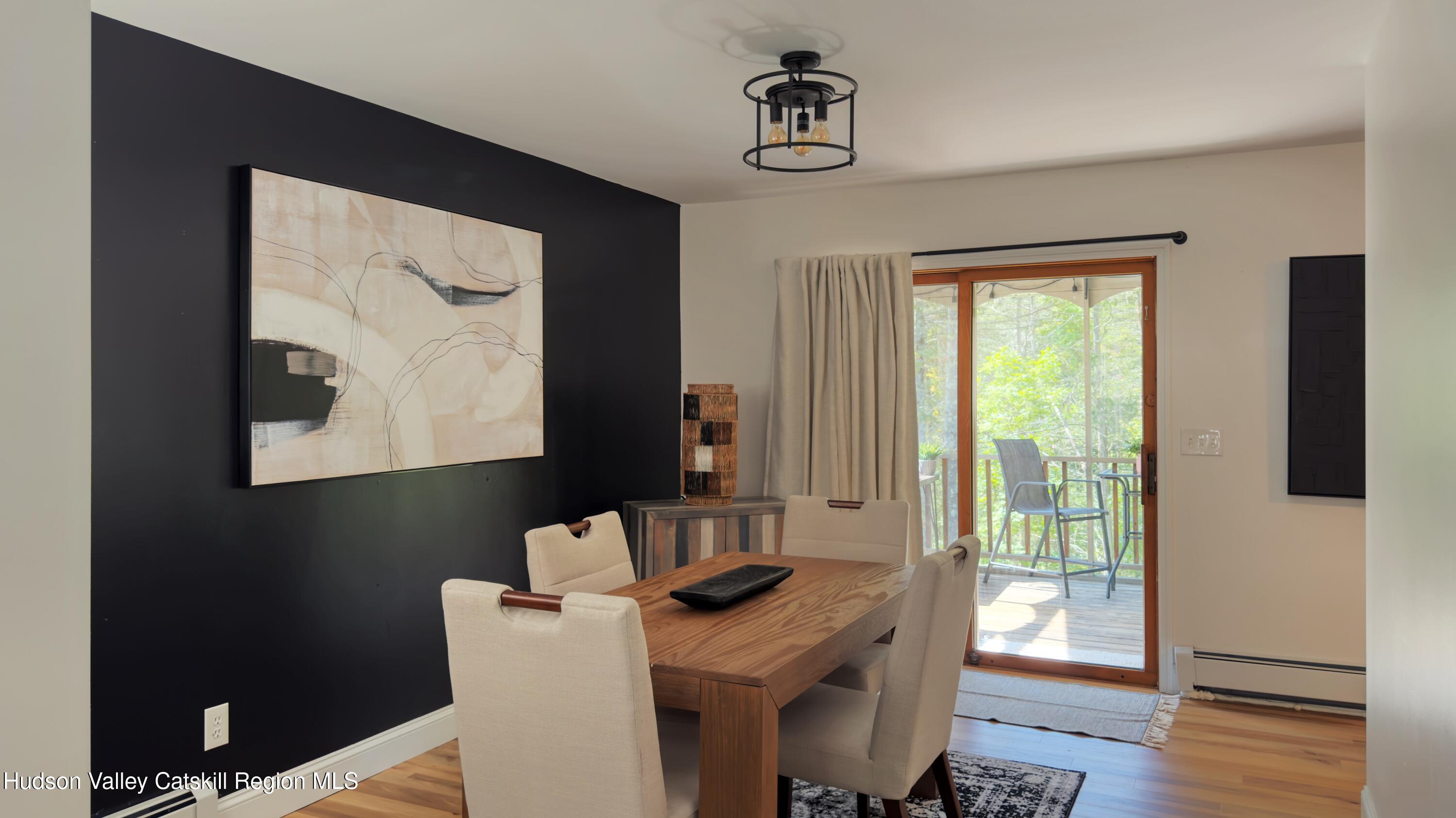 1801 Sleepy Hollow Road Athens, NY 12015 - Photo 7 of 34 a view of a workspace with furniture and wooden floor