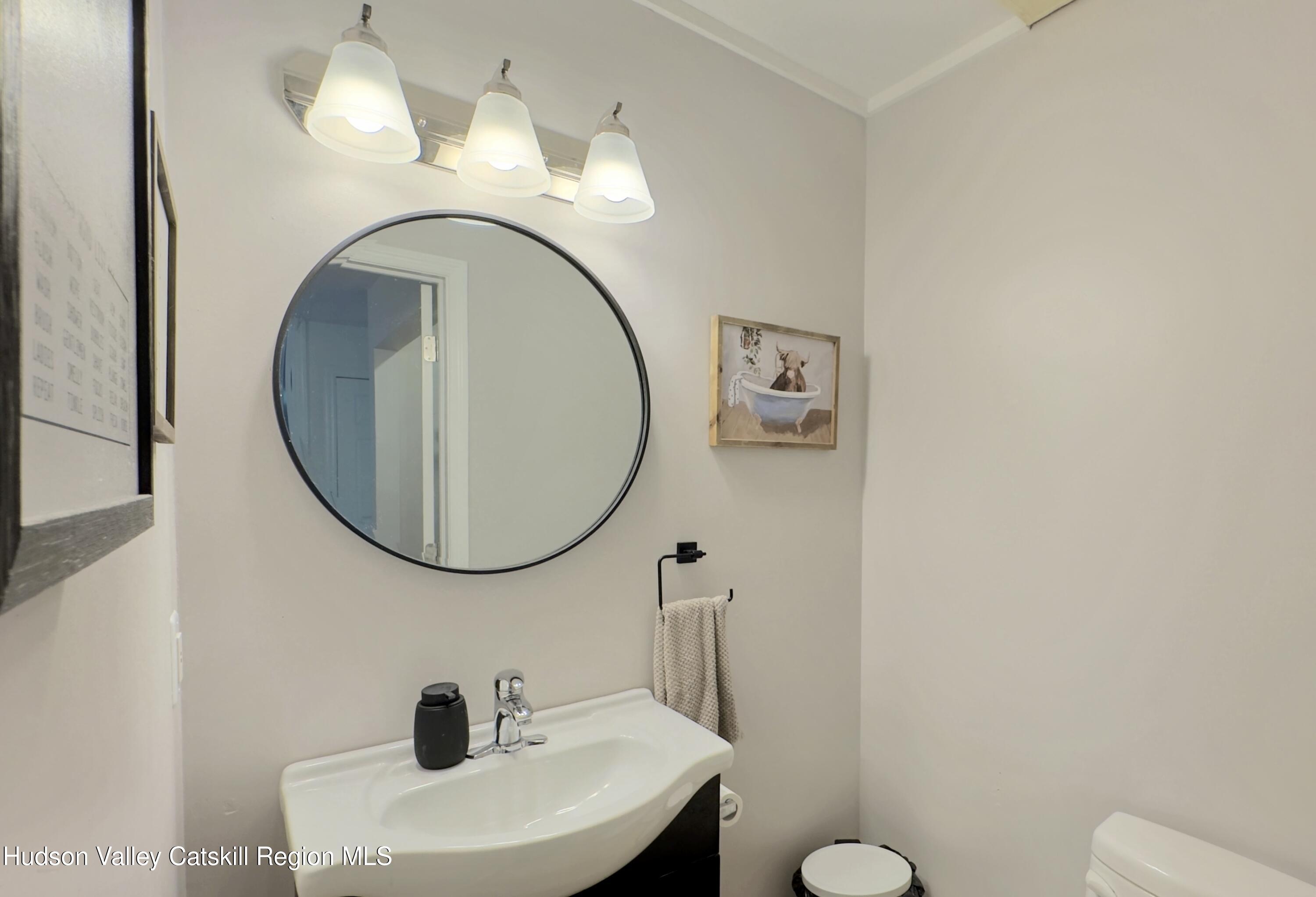 1801 Sleepy Hollow Road Athens, NY 12015 - Photo 10 of 34 a bathroom with a sink mirror and toilet