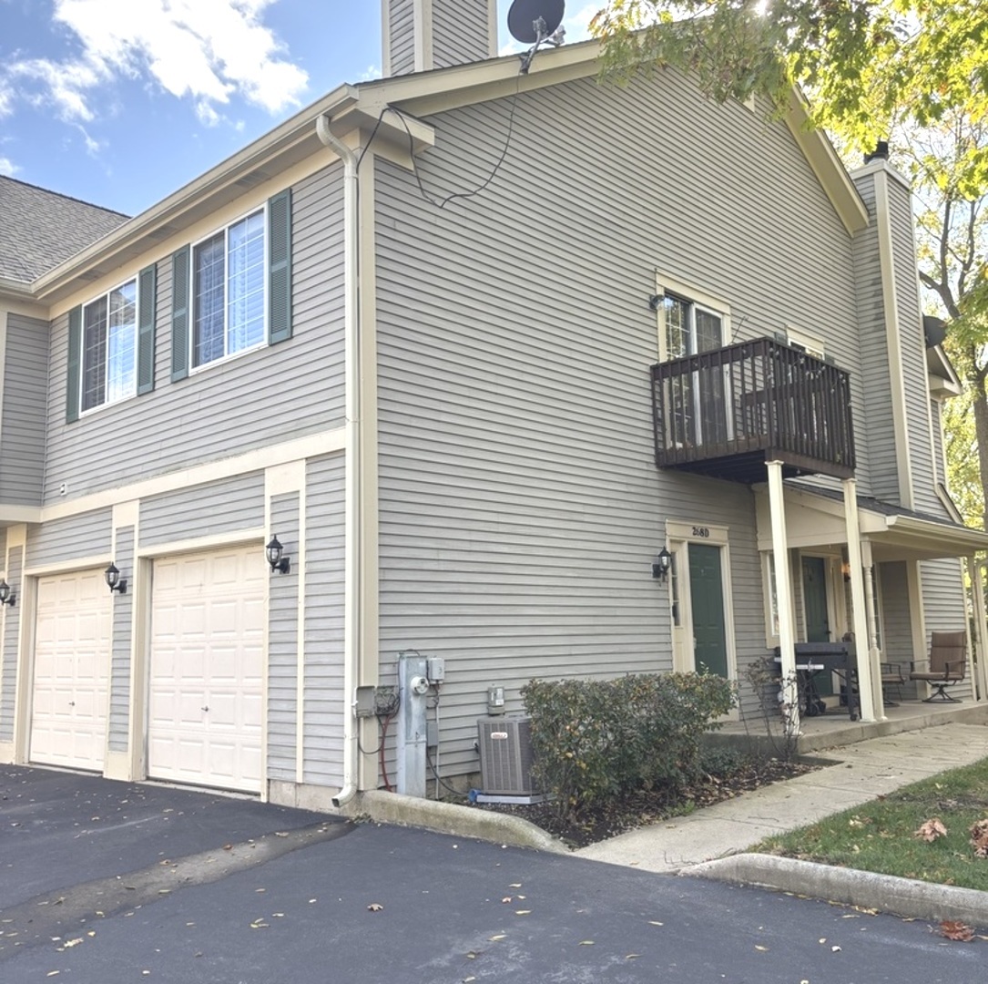 a view of a house with a yard and garage