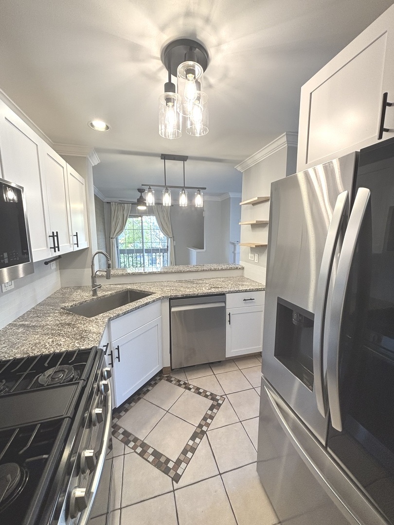 268 Windsor Court, Unit D South Elgin, IL 60177 - Photo 10 of 21 a large kitchen with a large counter top space appliances and cabinets
