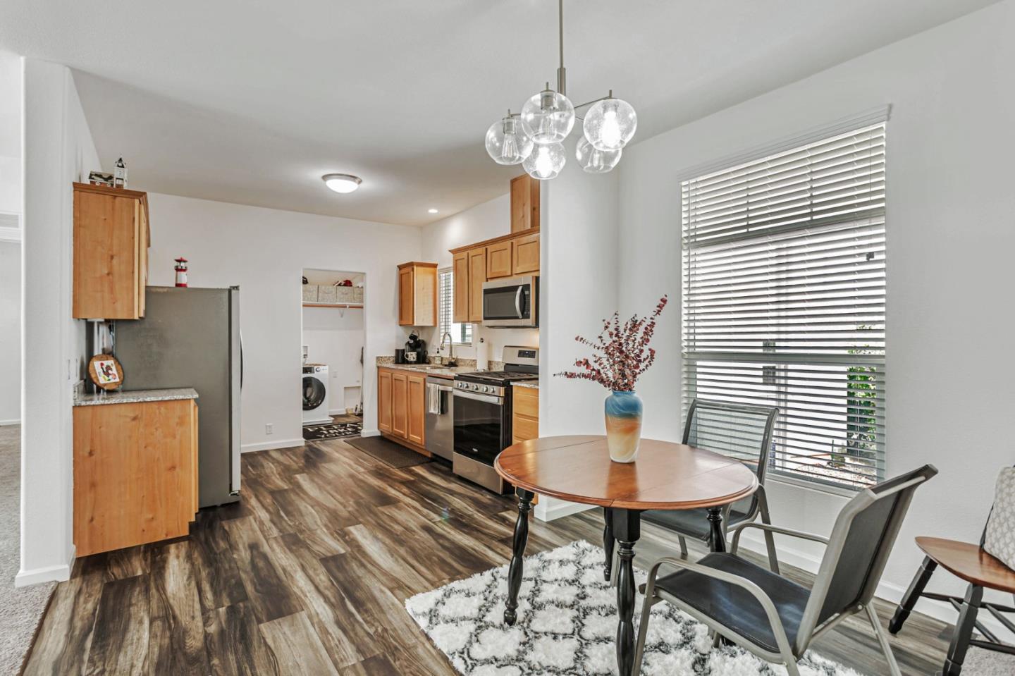 356 Reservation Road, Unit 68 Marina, CA 93933 - Photo 13 of 32 a view of a dining room with furniture and wooden floor